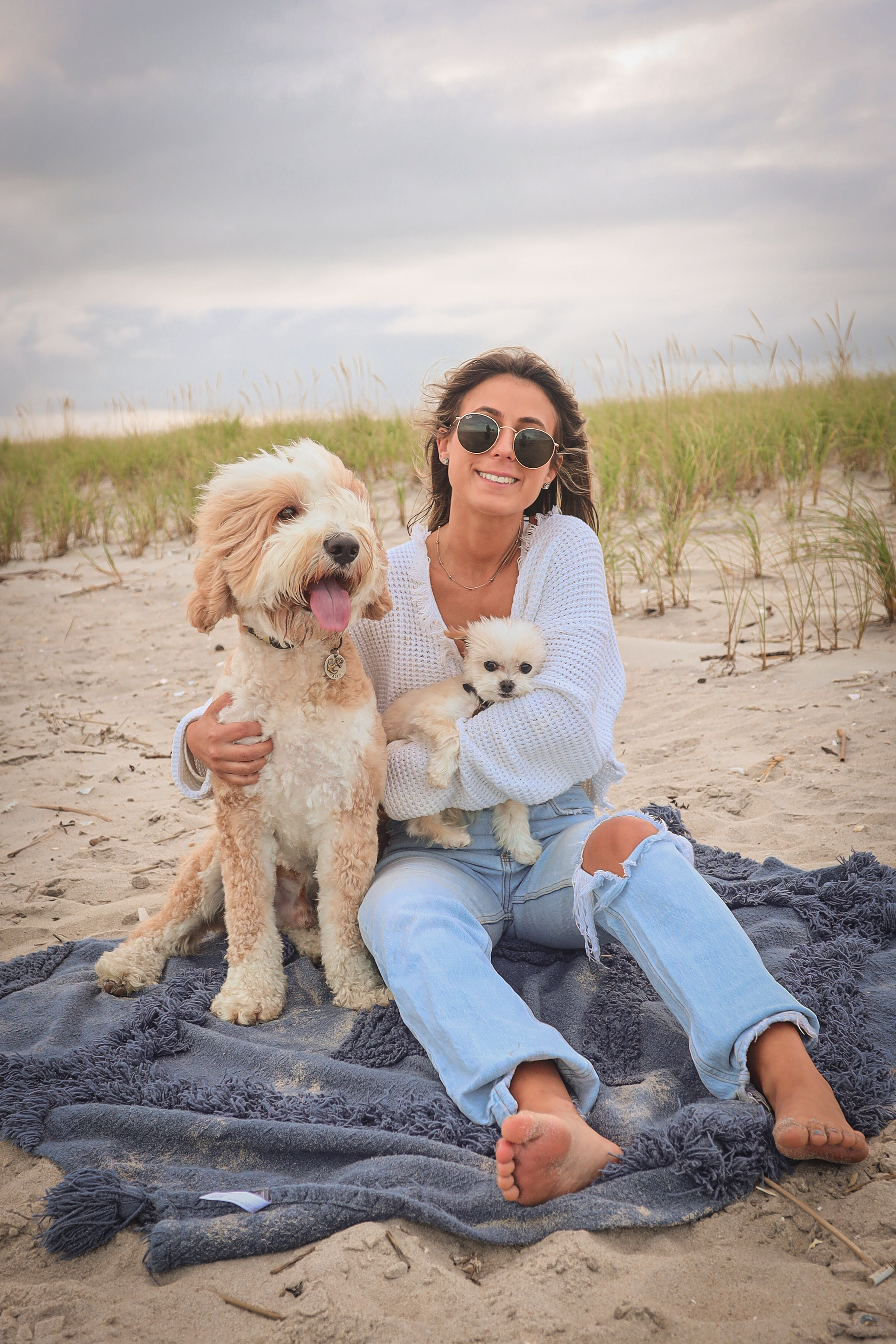 image of caitlyn on beach with dogs